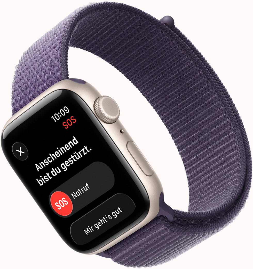Apple Watch SE 3, Aluminiumgehäuse, Farbe Polarstern, Mitteilung SOS Sturzerkennung, Tasten für Notruf und „Mir geht's gut“, rechte Seitenansicht, Digital Crown, Mikrofon, Seitentaste, Armband, Sport Loop, Farbe Nebelviolett