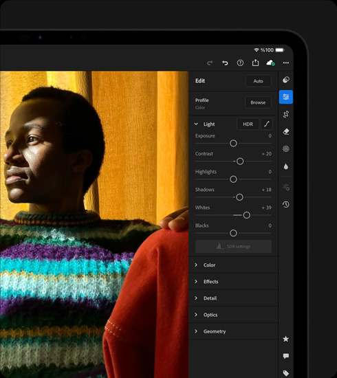 iPad Pro, önden dış görünüm, yatay pozisyonda, uzay siyahı renk, ekranda çok renkli kazak giymiş bir kişinin fotoğrafının düzenlendiği görülüyor, sağda araçlar ve efektler menüsü açık