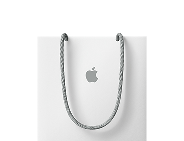A carrier bag with the Apple logo on the front centre