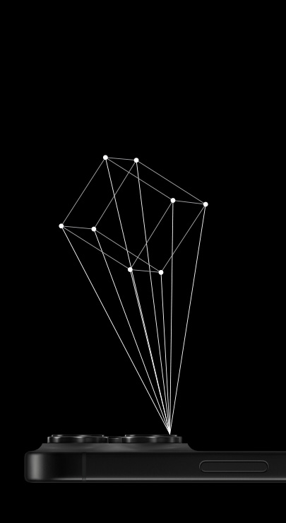 An iPhone lies face down with an outline of a 3D cube projecting from the iPhone's LiDAR scanner