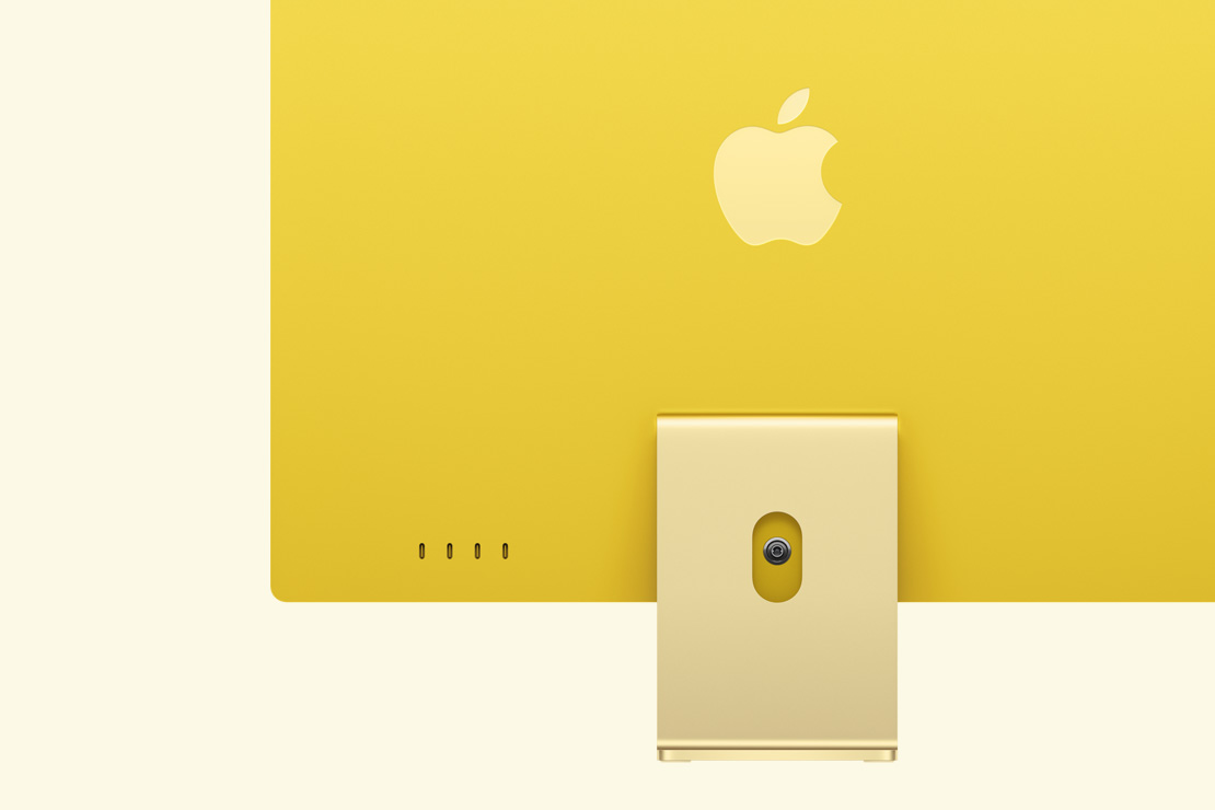 Vista posterior de un iMac amarillo, que destaca los cuatro puertos USB-C