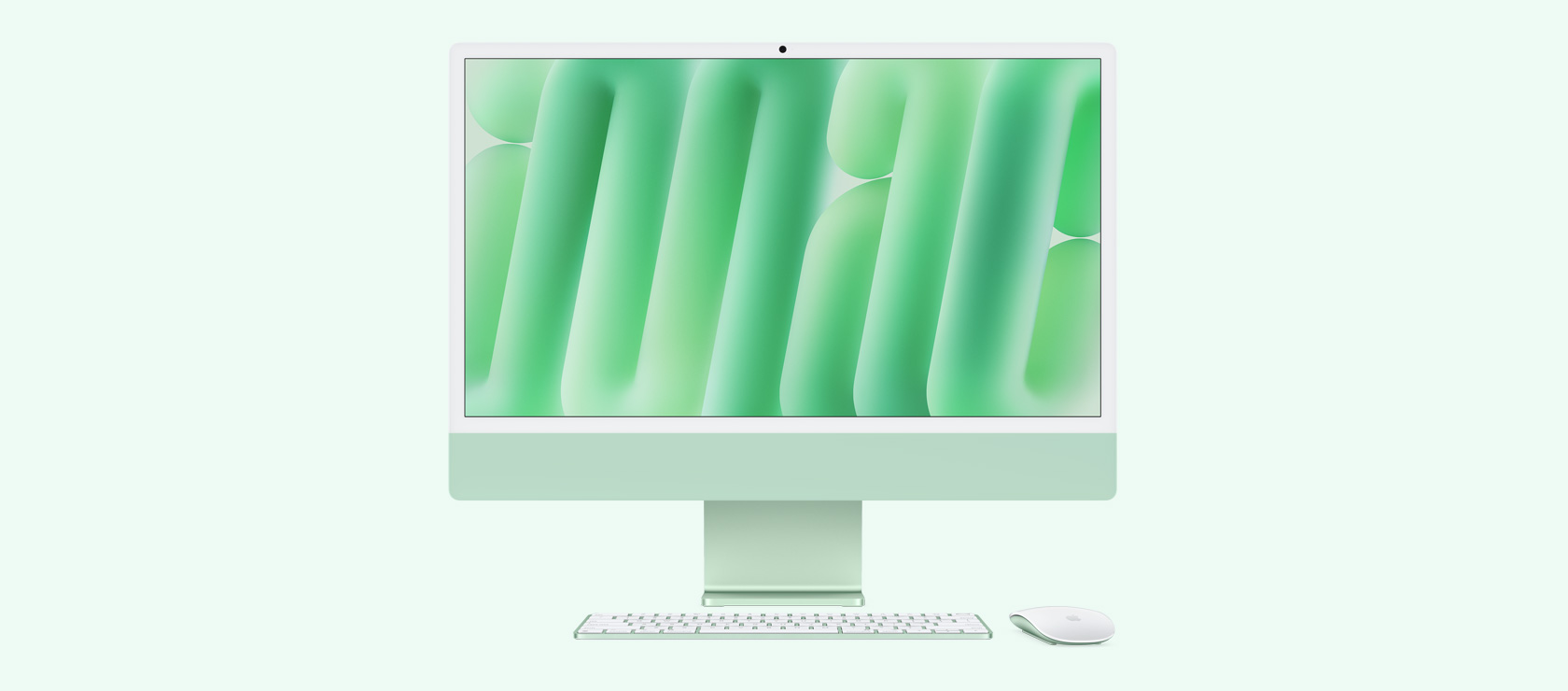 Vista frontal de un iMac verde con mouse y teclado a juego