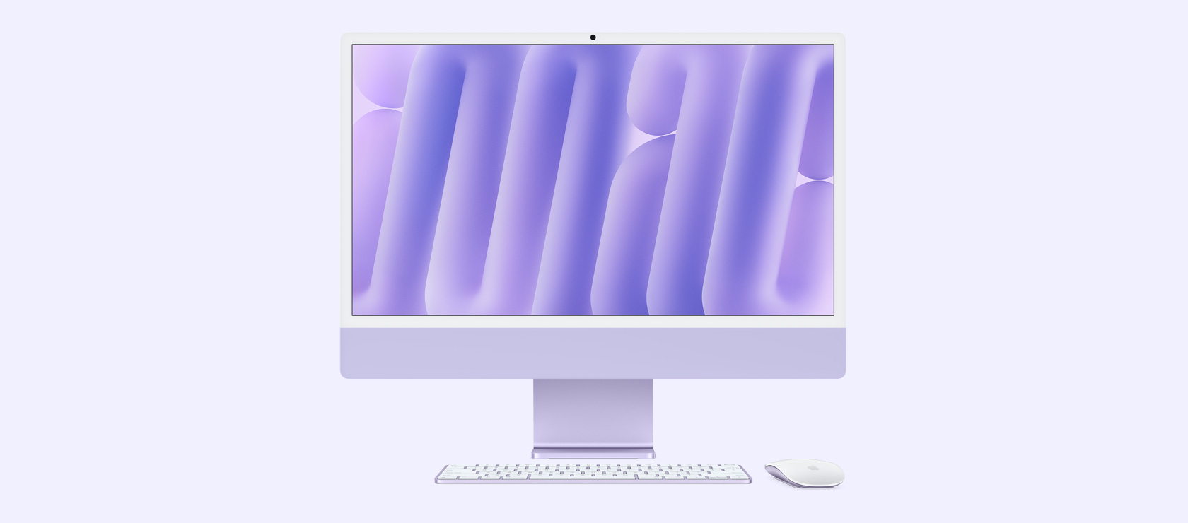 Vista frontal de un iMac morado con mouse y teclado a juego