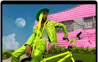 MacBook Air screen showing photo of person in colorful outfit, demonstrating color range and resolution of Liquid Retina display